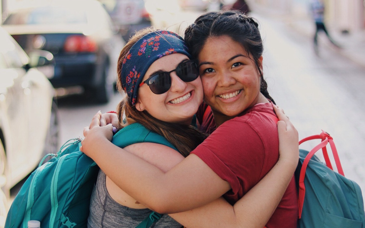 Two girls hugging